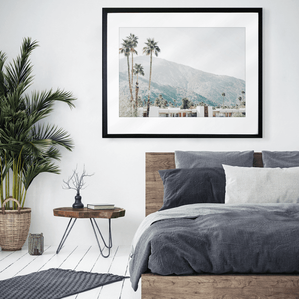 palm tree wall art against a mountain backdrop