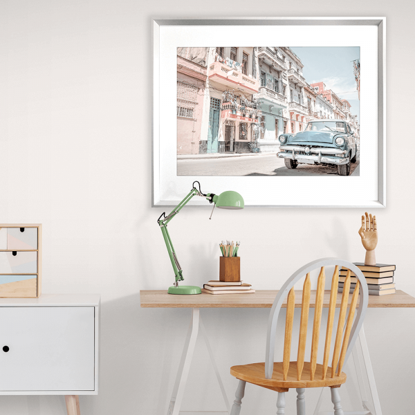 Wall Mounted Wanderlust Wall Art - Havana 01 Studio Collection. Featuring a classic Havana street landscape in soft pink, blue and aqua tones and with a pale blue sunny skyline in the background