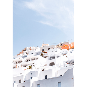 Unframed Greek Island Photo featuring iconic European white coastal homes under a soothing pale blue skyline.