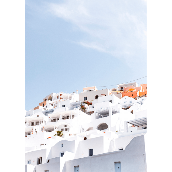 Unframed Greek Island Photo featuring iconic European white coastal homes under a soothing pale blue skyline.