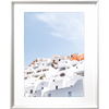 White framed Greek Island Photo featuring iconic European white coastal homes under a soothing pale blue skyline.