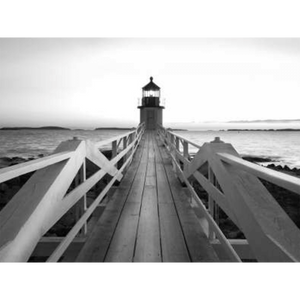 Black and white wall art features a single pier cascading into the deep ocean, culminating at a light house in canvas