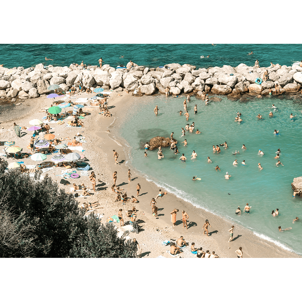 Stretched canvas Coastal Wall Art Vacanza 02 – Studio Collection, featuring the European beach coastline with holiday beach lovers bathing in the sunshine.