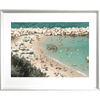 Silver framed Coastal Wall Art Vacanza 02 – Studio Collection, featuring the European beach coastline with holiday beach lovers bathing in the sunshine.